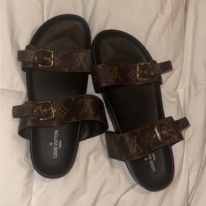 LV sandals. Never been worn. Only tried on